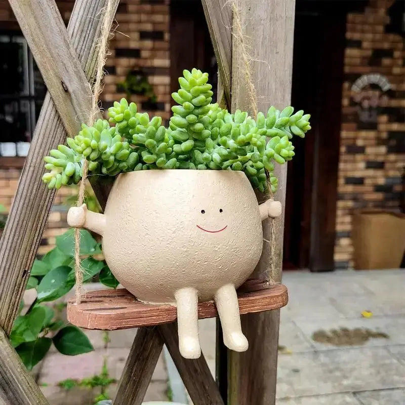 Swing Face Planter Pot erfect for displaying your favorite plants or flowers, this pot is a versatile addition to any room in your home. The swing design adds an element of playful elegance, My Store