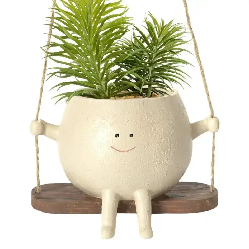 Swing Face Planter Pot erfect for displaying your favorite plants or flowers, this pot is a versatile addition to any room in your home. The swing design adds an element of playful elegance, My Store