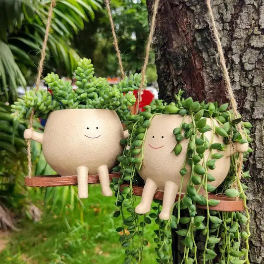Swing Face Planter Pot erfect for displaying your favorite plants or flowers, this pot is a versatile addition to any room in your home. The swing design adds an element of playful elegance, My Store